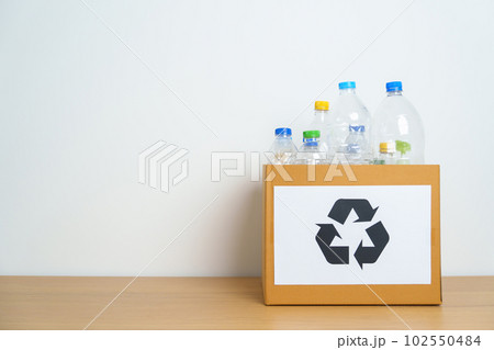 Plastic bottle in paper box at home or office. Recycle garbage Sorting. Plastic Free, Ecology, Environmental, pollution, Dispose recycling, waste management and trash Separation concept Plastic bottle in paper box at home or office. Recycle garbage Sorting. Plastic Free, Ecology, Environmental, pollution, Dispose recycling, waste management and trash Separation concept 102550484