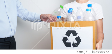 Volunteer keep plastic bottle into paper box at home or office. Hand Sorting Recycle garbage. Ecology, Environmental, pollution, Dispose recycling, waste management and trash Separation concept Volunteer keep plastic bottle into paper box at home or office. Hand Sorting Recycle garbage. Ecology, Environmental, pollution, Dispose recycling, waste management and trash Separation concept 102550572