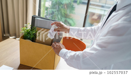 Quit Job Business man sending resignation letter and packing Stuff Resign Depress or carrying business cardboard box in office. Change of job or fired from company. Quit Job Business man sending resignation letter and packing Stuff Resign Depress or carrying business cardboard box in office. Change of job or fired from company. 102557037
