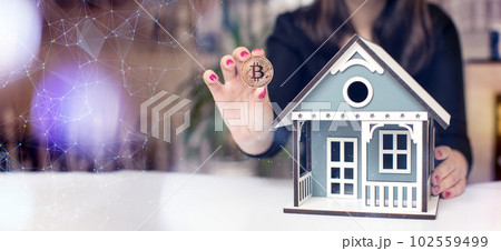 Businesswoman reflects on investing profits in bitcoin or real estate Businesswoman reflects on investing profits in bitcoin or real estate 102559499