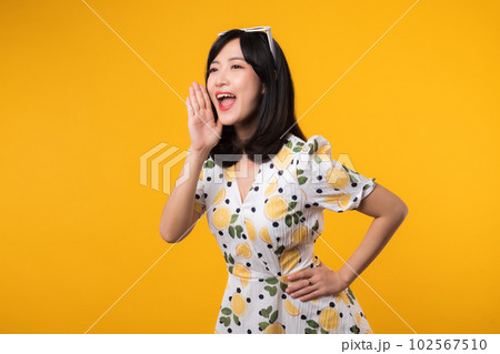 Portrait cheerful happy attractive asian young woman announcing shout message in copy space isolated on yellow background. Promotion advertising or news communication concept. Portrait cheerful happy attractive asian young woman announcing shout message in copy space isolated on yellow background. Promotion advertising or news communication concept. 102567510