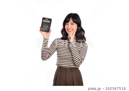 Young Asian woman casual uniform holding calculator over white background. Business and financial concept 102567518
