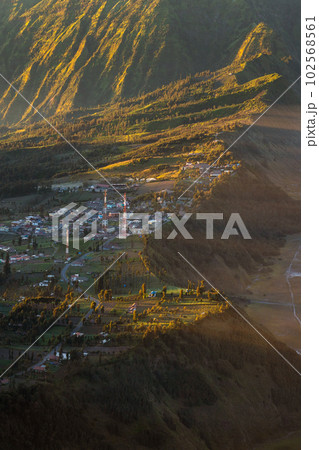 Small town on the hill with sunlight. 102568561
