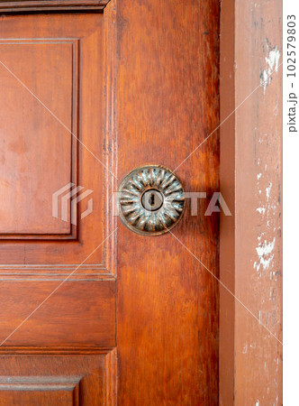 The brass door knob in the retro style. 102579803
