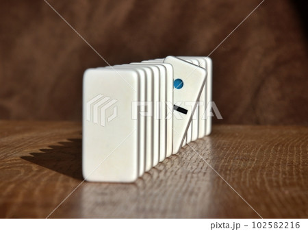 Line of dominoes with one looking out 102582216