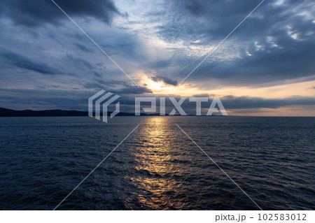 Cloudy Cloudscape during stormy everning on the West Coast of Pacific Ocean. 102583012
