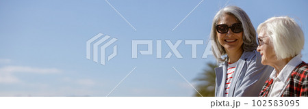 Shot of adult modern women resting outdoors 102583095