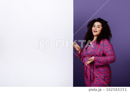 Plus size woman in bright suit Plus size woman in bright suit 102583151