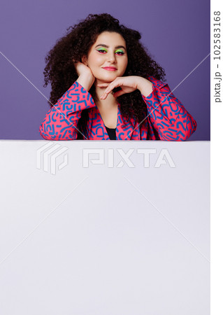 Plus size woman in bright suit 102583168
