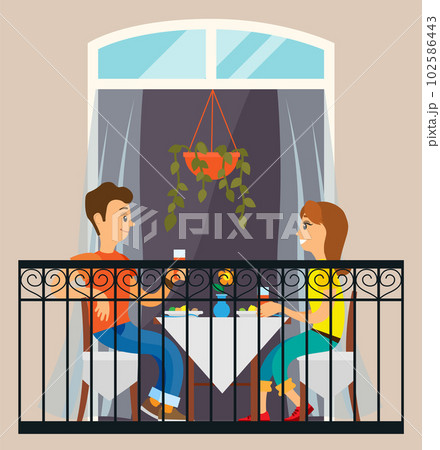 Lovers on a date in a restaurant. Couple celebrate the holiday together at home on the balcony 102586443