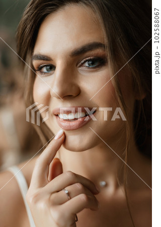 bride's preparations for a wedding in a  cottage 102588067