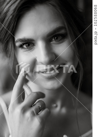 bride's preparations for a wedding in a  cottage 102588068