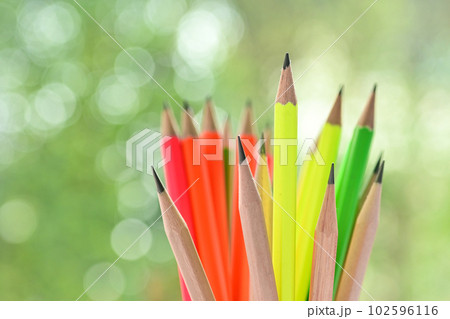 group of colourful sharp pencil on blur green nature background with bokeh group of colourful sharp pencil on blur green nature background with bokeh 102596116