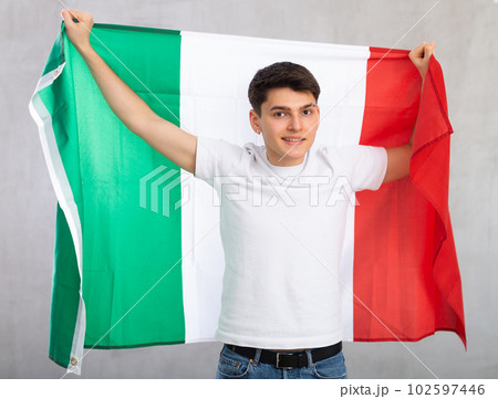 Portrait of calm smiling, friendly middle-aged male businessman with national flag of Italy. 102597446