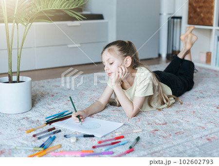 Child girl drawing with colorful pencils Child girl drawing with colorful pencils 102602793