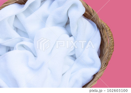Used towel in a wicker basket Used towel in a wicker basket 102603100