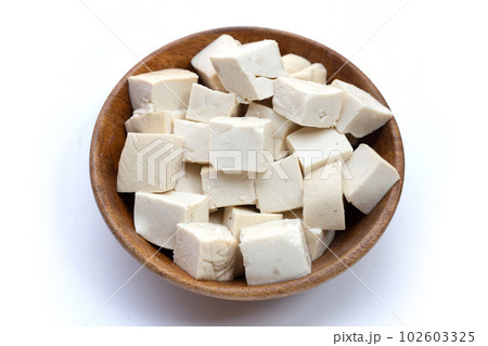 White tofu in wooden bowl on white background. 102603325