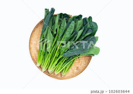 Fresh spinach on white background Fresh spinach on white background 102603644