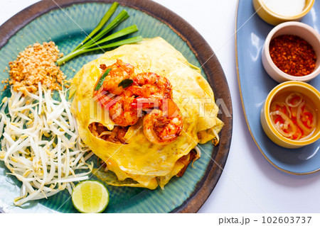 Prawn pad Thai noodles with egg wrap Thailand street food Prawn pad Thai noodles with egg wrap Thailand street food 102603737