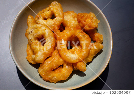 Fried squid in bowl. Top view Fried squid in bowl. Top view 102604007