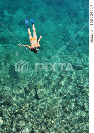Woman snorkeling in Phuket, Thailand Woman snorkeling in Phuket, Thailand 102604517