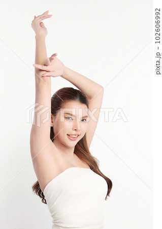 Beautiful Young Asian woman lifting hands up to show off clean and hygienic armpits or underarms on white background, Smooth armpit cleanliness and protection concept Beautiful Young Asian woman lifting hands up to show off clean and hygienic armpits or underarms on white background, Smooth armpit cleanliness and protection concept 102606992