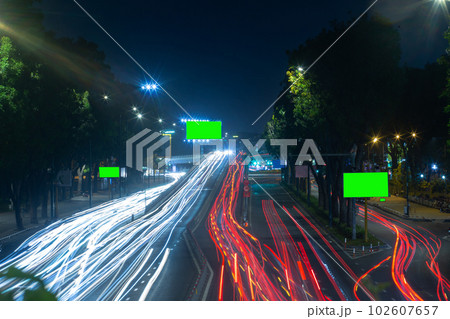 Time lapse photo at Nguyen Thai Son overpass in Ho Chi Minh city with billboards with green background 102607657