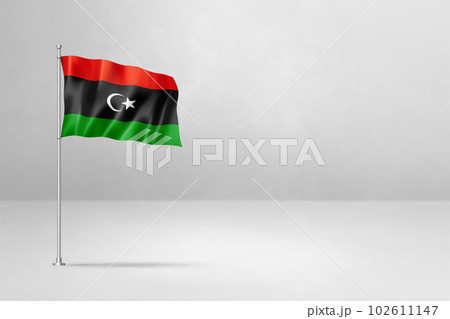 Libyan flag isolated on white concrete wall background 102611147