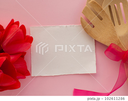 Tulips flowers with kitchen tools on background with copy space 102611286