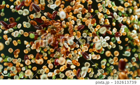 Freeze motion of rotating mix legumes pieces in the air 102613739