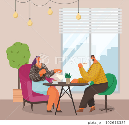 Man and woman sitting at the table with coffee in restaurant. Married couple drink tea at home 102618385