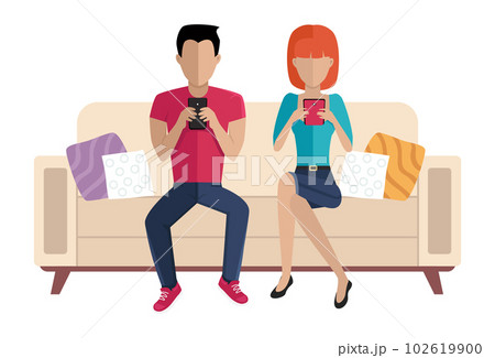 The couple is sitting on the couch. Girl and guy are chatting with a smartphone in their hands 102619900