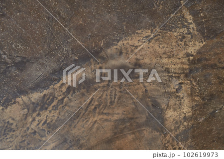 Abstract, mottled textured surface of stone material. Natural rock details with space to copy. Stone background, stone wall background with smooth texture. High quality photo 102619973