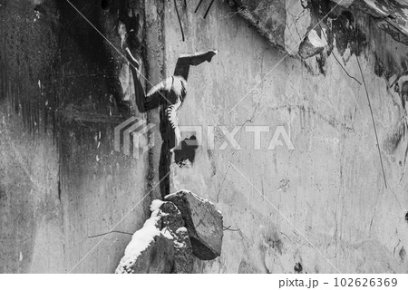 Banksy graffiti on a wall in Borodyanka, Ukraine, black and white photo Banksy graffiti on a wall in Borodyanka, Ukraine, black and white photo 102626369