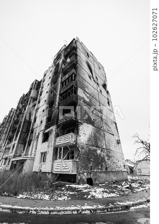 IRPIN, UKRAINE - NOVEMBER 29, 2022: Drawing by Banksy on the wall of a house in Irpin, Ukraine, black and white photo 102627071