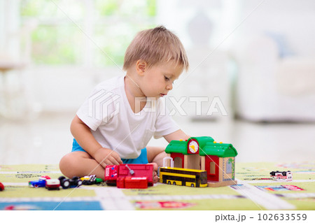 Boy playing toy cars. Kid with toys. Child and car 102633559