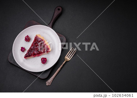 Delicious fragrant sweet pie with cherry berries on a ceramic plate Delicious fragrant sweet pie with cherry berries on a ceramic plate 102634061