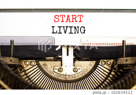 Start living symbol. Concept words Start living typed on beautiful old retro typewriter. Beautiful white background. Business and Start living concept. Copy space. Start living symbol. Concept words Start living typed on beautiful old retro typewriter. Beautiful white background. Business and Start living concept. Copy space. 102634212