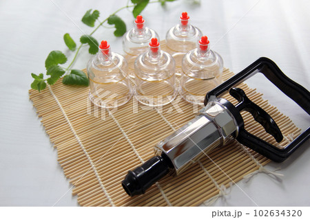 Concept image of cupping and medicine, a traditional oriental medicine 102634320