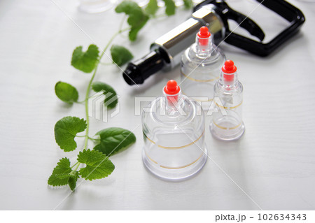 Concept image of cupping and medicine, a traditional oriental medicine 102634343