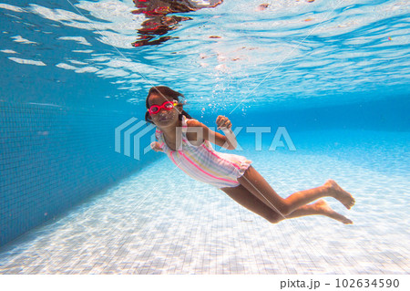 Child in swimming pool on ring toy. Kids swim. Child in swimming pool on ring toy. Kids swim. 102634590