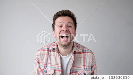 European funny young man is laughing loudly. Positive emotion 102636850