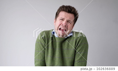 The young European man is crying from a life failure. His girlfriend left him and he lost his job. Unstable mental state The young European man is crying from a life failure. His girlfriend left him and he lost his job. Unstable mental state 102636889