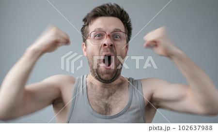Overjoyed mature man raising fists up. Achievement or win in lottery. 102637988