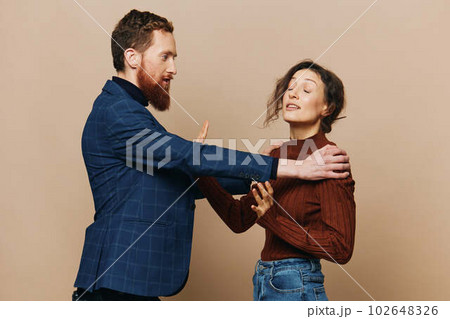 Man and woman couple in a relationship quarrel, yelling, psychological violence in the family, problems in a real relationship between people Man and woman couple in a relationship quarrel, yelling, psychological violence in the family, problems in a real relationship between people 102648326