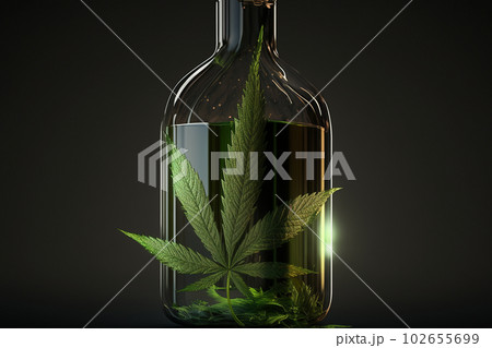Cannabis essential oil in a small bottle. CBD oil hemp products. 102655699