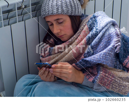 Woman sitting near the battery 102660235
