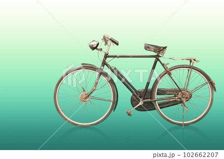 side view old and rust black and silver bicycle on gradient green background, object, decor, transport, copy space 102662207