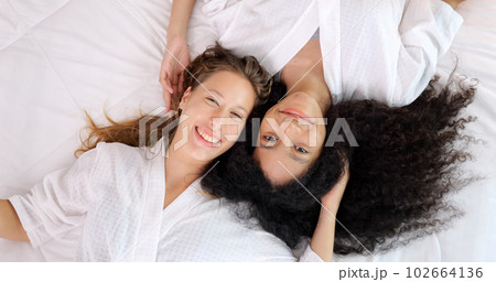 Cheerful close friends women expressing happy face with smile to camera 102664136
