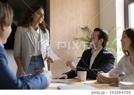 Diverse businesspeople solve business gathered in board room 102664789